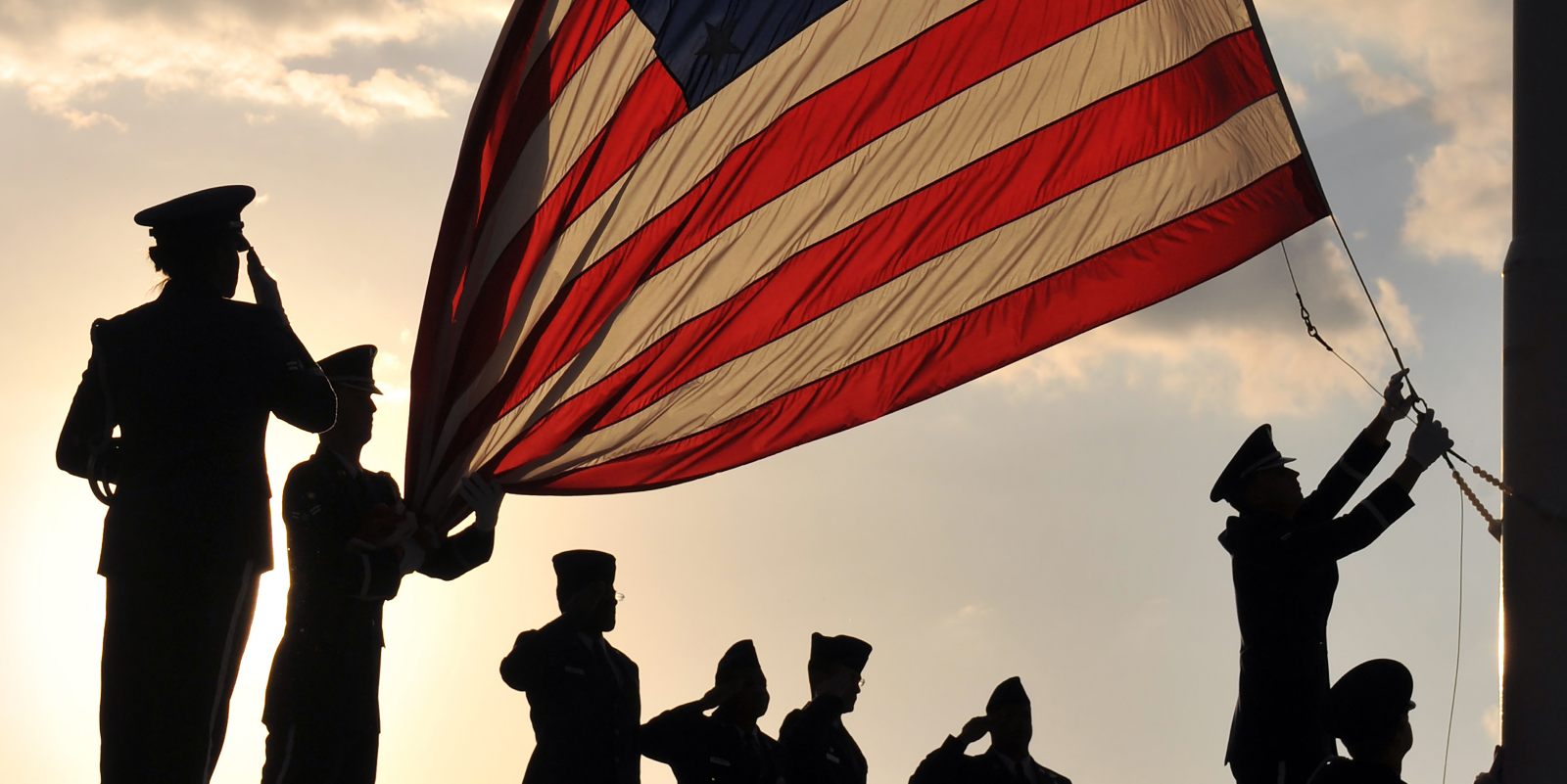 Servicemembers raising the flag